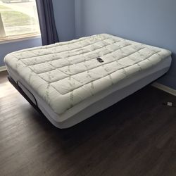 Queen sized bed on an adjustable base.
