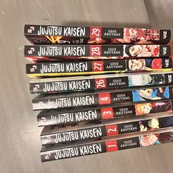 Jujutsu kaisen mangas and gojo and yuji figures