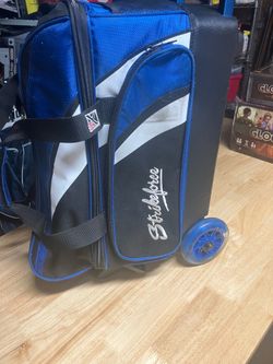 2 bowling balls and bags