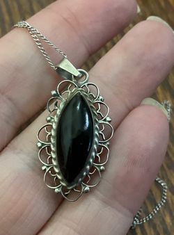 Black Onyx, sterling silver filigree ring. Marked Sterling Mexico, signed and numbered by the artist 18 inch chain.