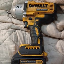 Milwaukee M18 FUEL 1/4" Hex Impact Driver with an attached M18 REDLITHIUM XC5.0 extended capacity battery pack. DEWALT 20V MAX* XR® 1/2 in. High Torqu