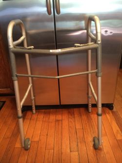 Walker sturdy foldable adjustable for high& down. With wheels