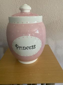 10 inch tall, princess cookie jar. Like new condition.