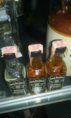 3 old mini jack daniels bottles