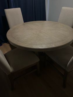 Dining room table with fabric chairs