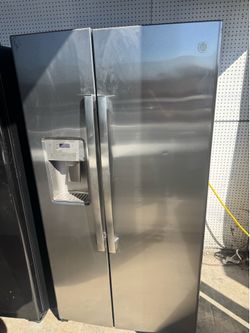 GE side-by-side refrigerator with 90 day warranty $499
