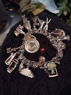 Vintage sterling silver menards charm bracelet with 19 charms and double links