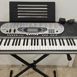  Casio CTK-573 61-key electronic keyboard.
