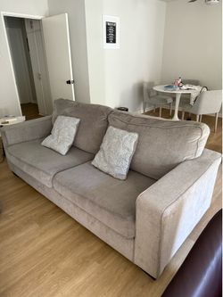 Grey couch with queen pullout bed