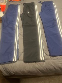 Boys size 12 navy, and size 14 navy pairs, and black pair , New!! sweatpants Oshkosh, $12 each.. take all 3 pairs for $30