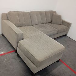 Brown small sectional couch
