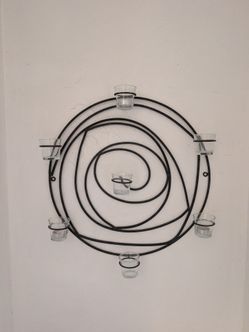 Modern black metal wall-mounted candle holder