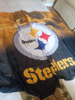 Pittsburgh Steelers clock, curtains, and large photo of Heinz Field