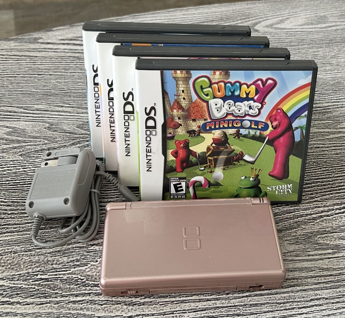 Metallic Gold Nintendo DS with 4 games, complete with stylus & charger. $60