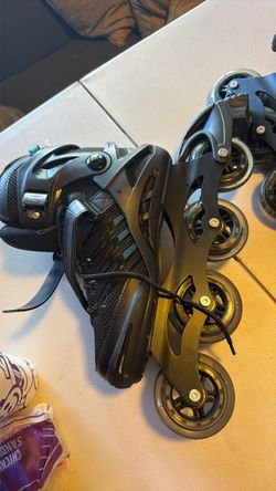 Roller Derry skates with sweat bands and skating pads