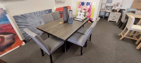 Brown 7pc dining set with gray chairs