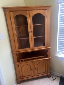 Corner storage and display cabinet