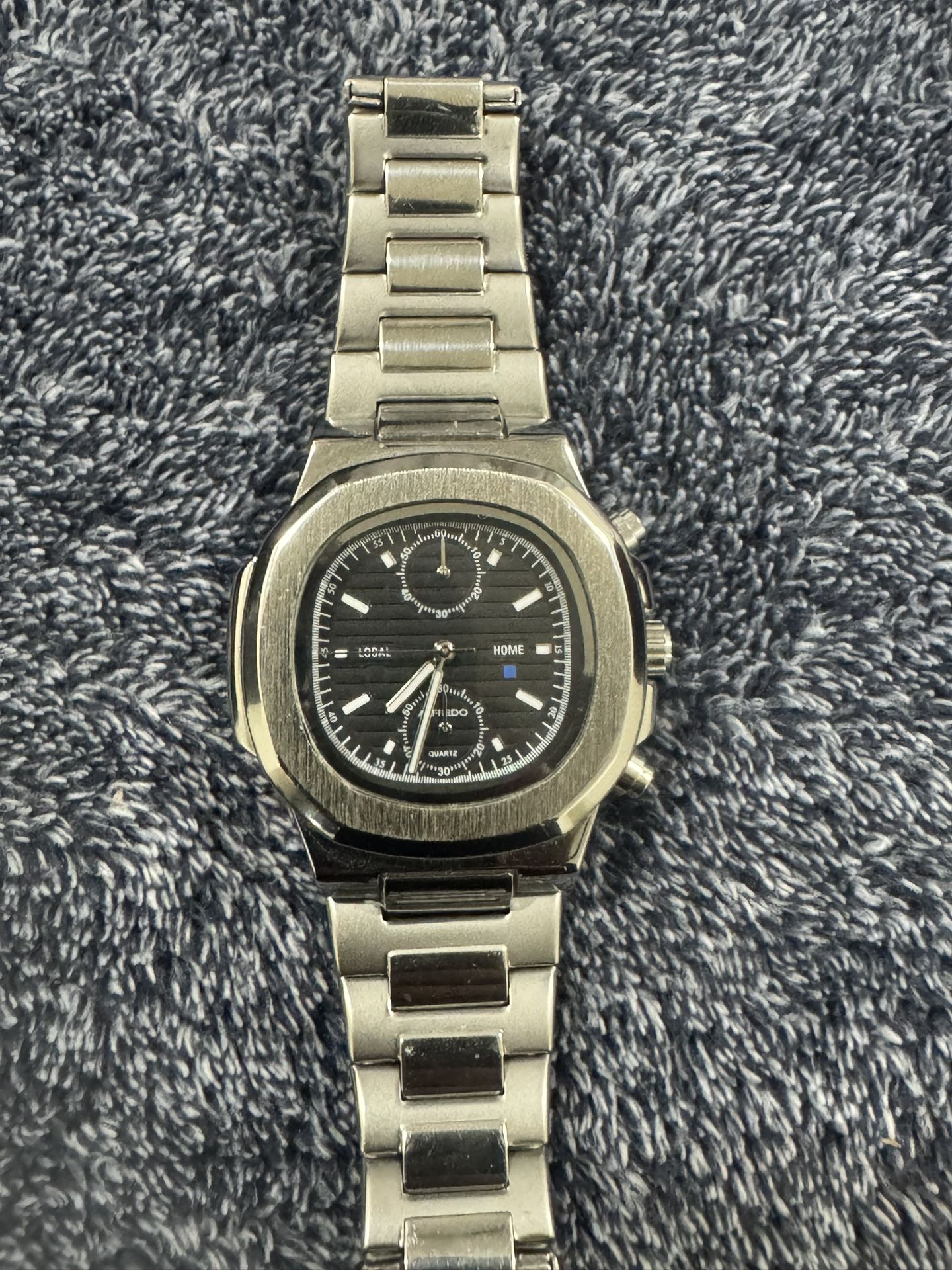 This is an Alfredo stainless steel quartz watch