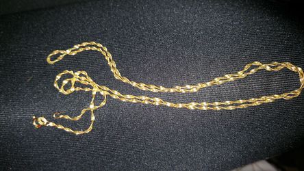 Sterling silver gold colored long chain necklace I'm guessing it's 24 to 26 inches long