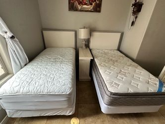 Two Twin Beds with frames, headboards, box springs and mattresses