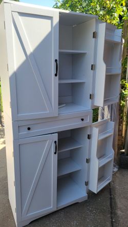 White farmhouse pantry style cabinet