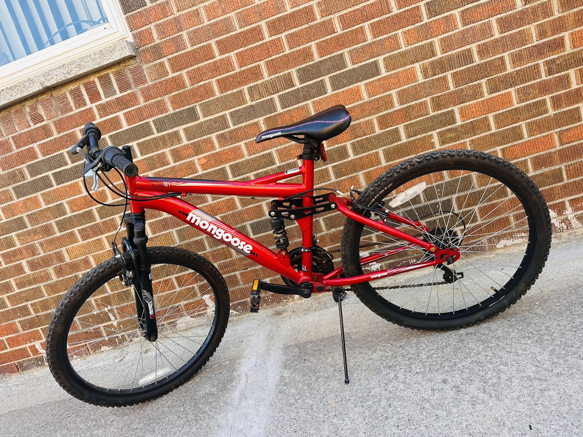 Red Mongoose 24-inch bike with great brakes and tires