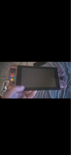 """nintendo switch 1 with some stuff look at pics 150$$ used no dock