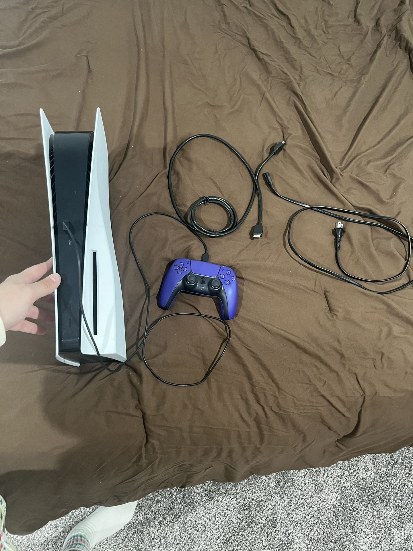 PS5 with cables and controller