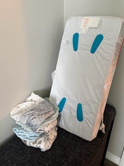 Brand new changing table mattress with fitted sheets