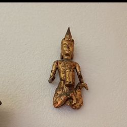 hand-painted, gilded wood kneeling statue, possibly depicting a Teppanom guardian angel or a similar figure from Buddhist or Thai mythology. 