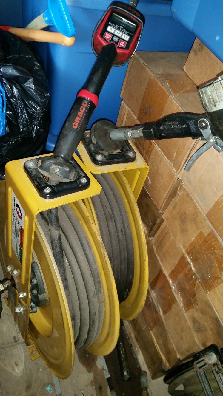 2 Graco Liquid Delivery Reels With Dispensing Nozzles