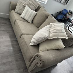 Beige couch (Great condition) W / Pillows
