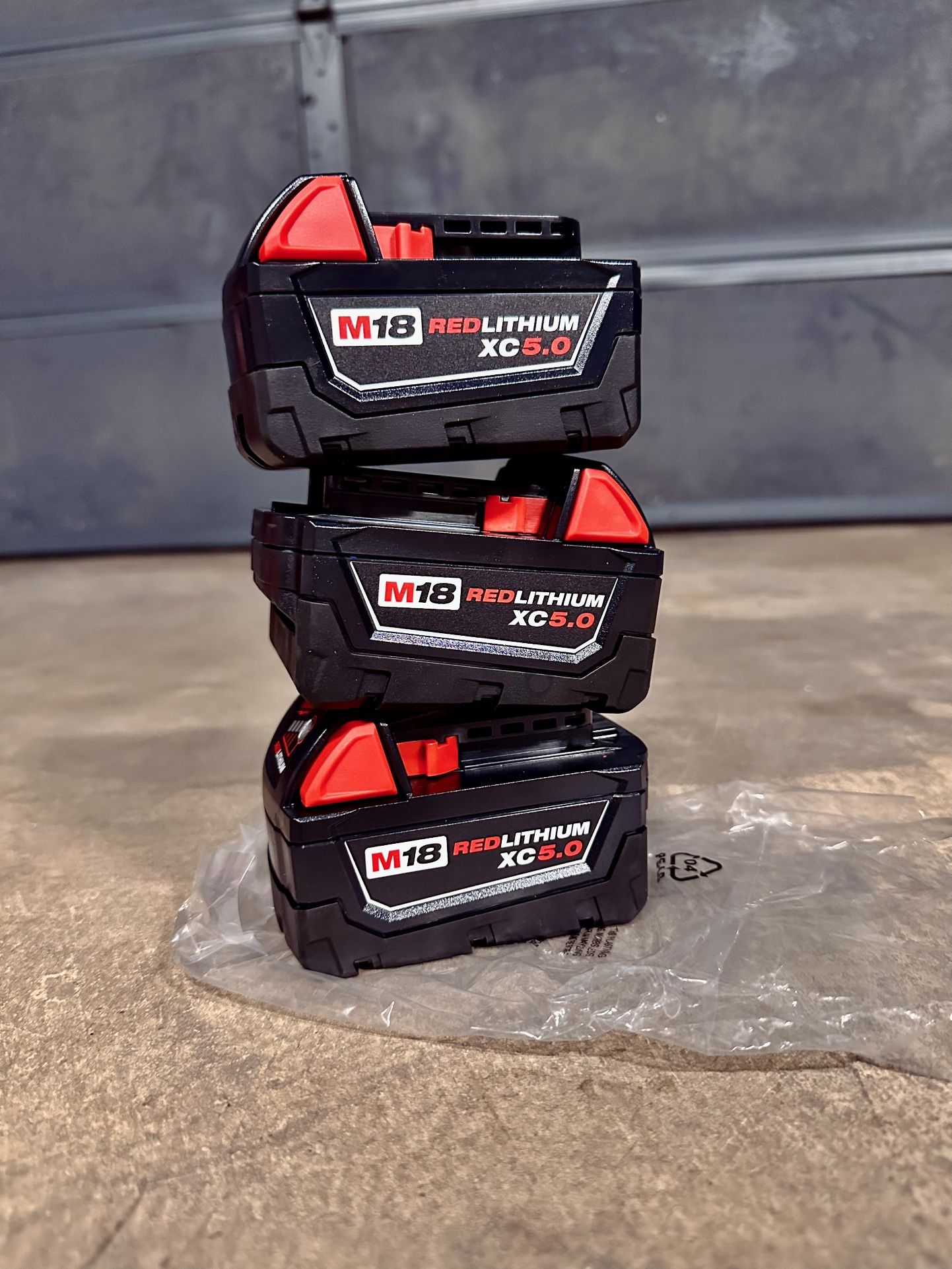 Three Milwaukee M18 5.0 Batteries