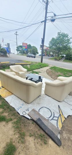 Leather sofa and loveseat and chair with black glass Coffee Table
