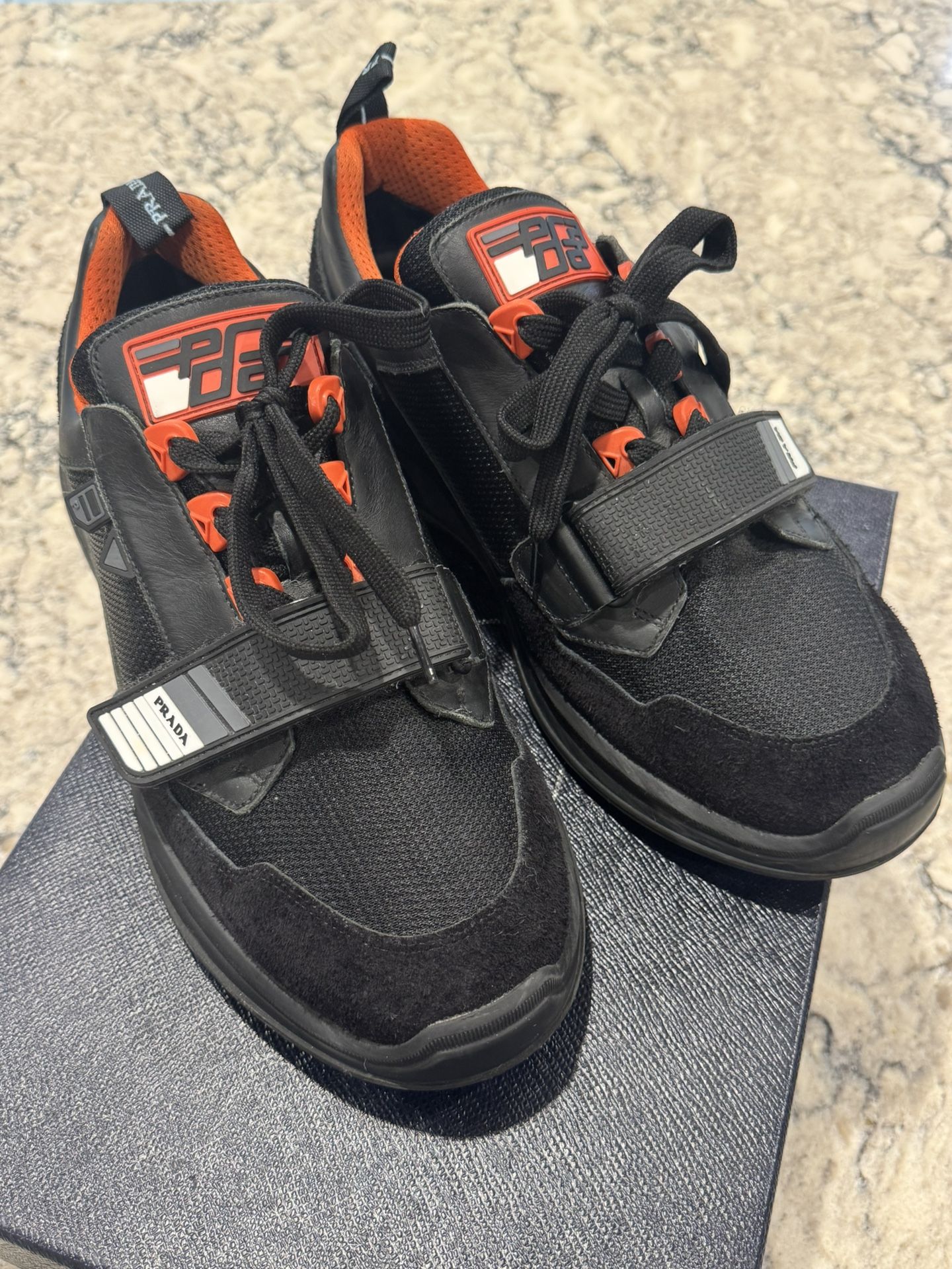 Prada Mechano Orange and Black Trainers