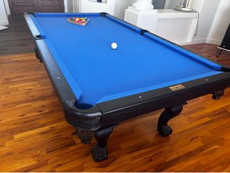 8 foot pool table and cue stick holder looks new