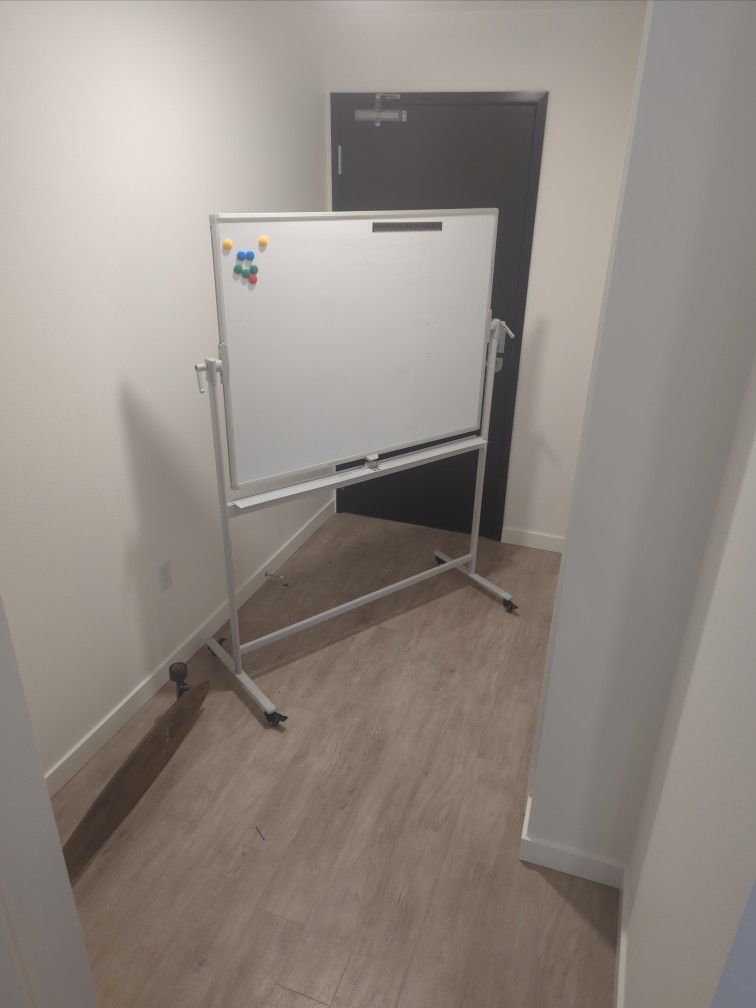 Whiteboard. Double-Sided Magnetic Mobile Whiteboard On Wheels With A Couple Magnets