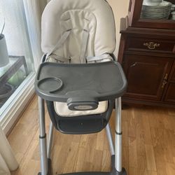 High Chair For Baby And Toddler With Extra Booster Seat And Lots Of Baby Toys And Books 