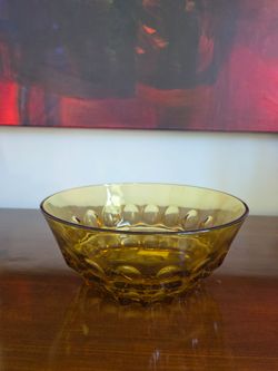 Amber pressed glass bowl with thumbprint pattern by Hazel Atlas