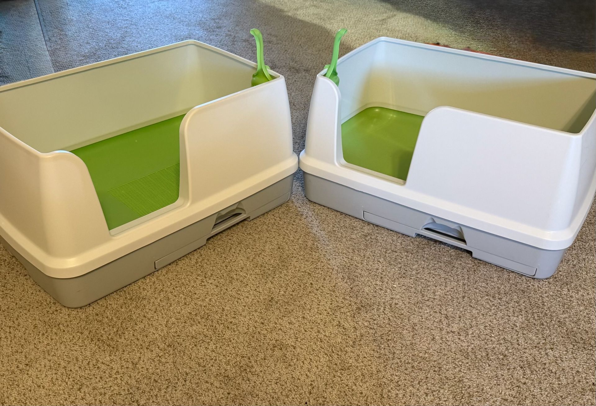 For sale: two gently used cat litter boxes, complete with a handy poop scooper. Both have been thoroughly cleaned and are ready for their next feline