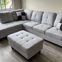 Gray linen  sectional couch and ottoman