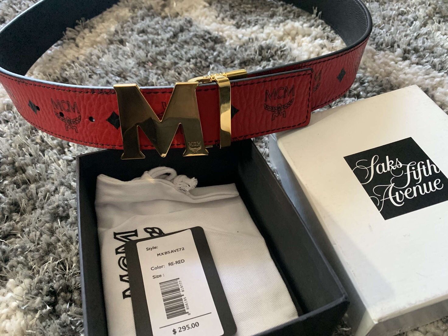 Size 32 MCM belt with gold buckle with reversible black side