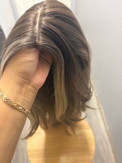 20-inch semi-natural hair wig with blonde highlights in the front.