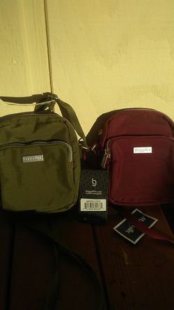 Baggallini purses. Brand new. Tags still on. $16.00 EACH. Green and Burgundy. 6 inch x 6 inch.