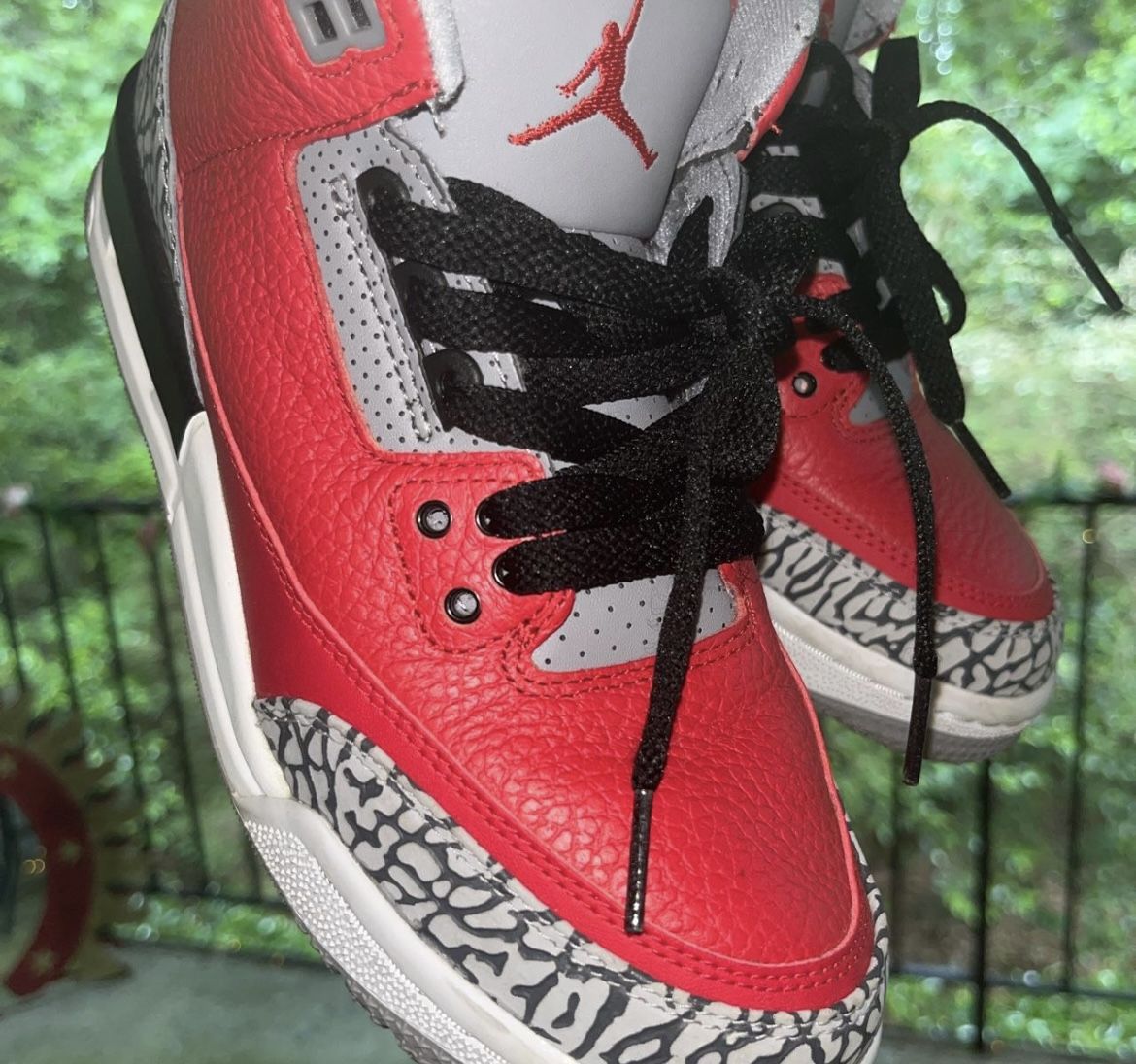 fire red 3s on feet