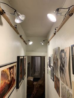Handmade track lighting for your art filled hallway!