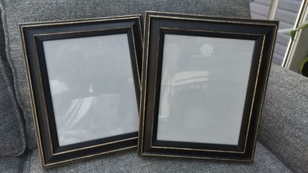 Beautiful pair of Black/Gold Picture Frames. 11"w x 13" h outside, inside 8" w x 9.5" h. Can be sold separately for $20 each