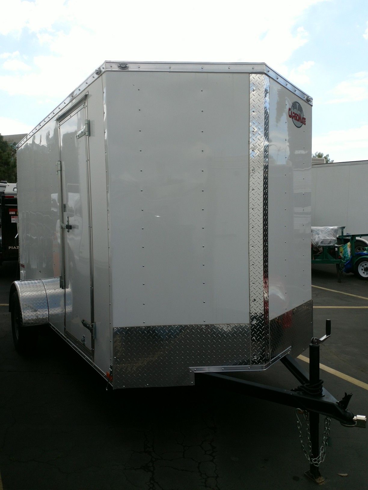 12' enclosed cargo trailer. SALE or RENT. 6' wide x 6' tall door opening. Single axle 2,990# GVWR. Ramp door + side door. Chrome package. LED lights.