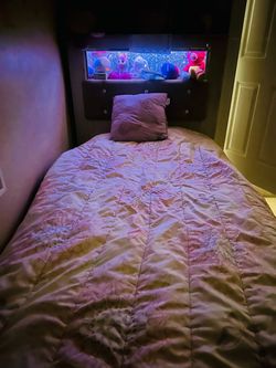 For sale: 3 wooden beds (single size) in excellent condition: • Two white wooden beds with an identical design. • One cream-colored bed, featuring a p