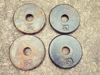 Weights - 2 1/2 lb plates; for 1 inch weight; notice varying condition; $1.50 per lb (see price list)